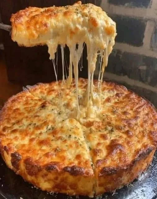 Cheesy Garlic Bread Pie with melted cheese and garlic crust